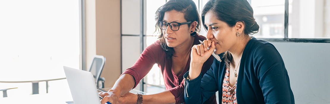 2 women reviewing financial plans