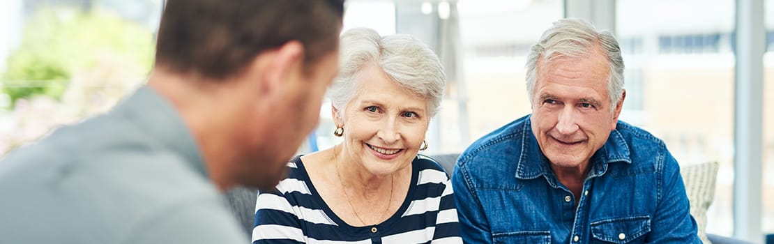 Shot of senior couple having a consultation with a financial advisor at home