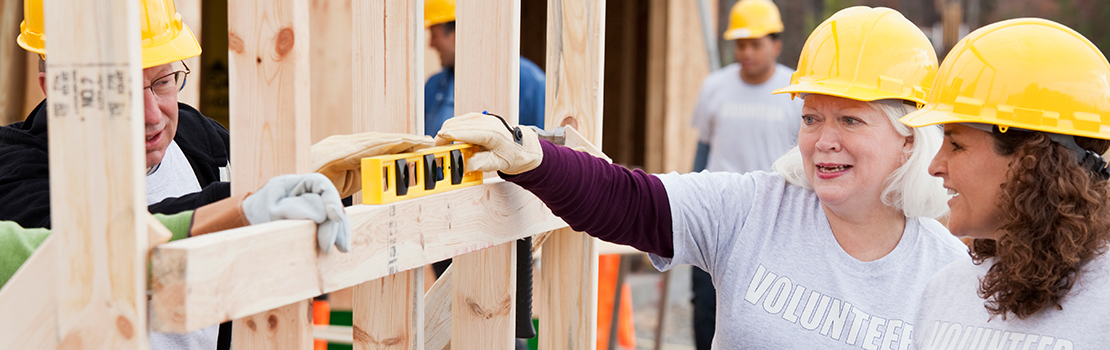 Volunteers working on construction site